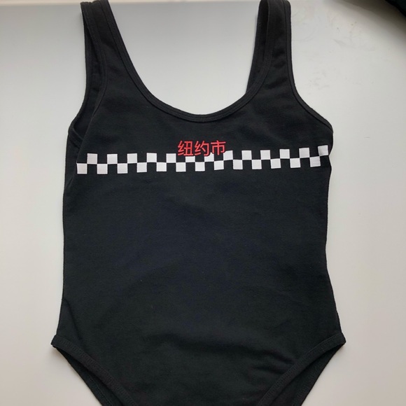 Forever 21 Tops - black open back body suit w/graphic across chest